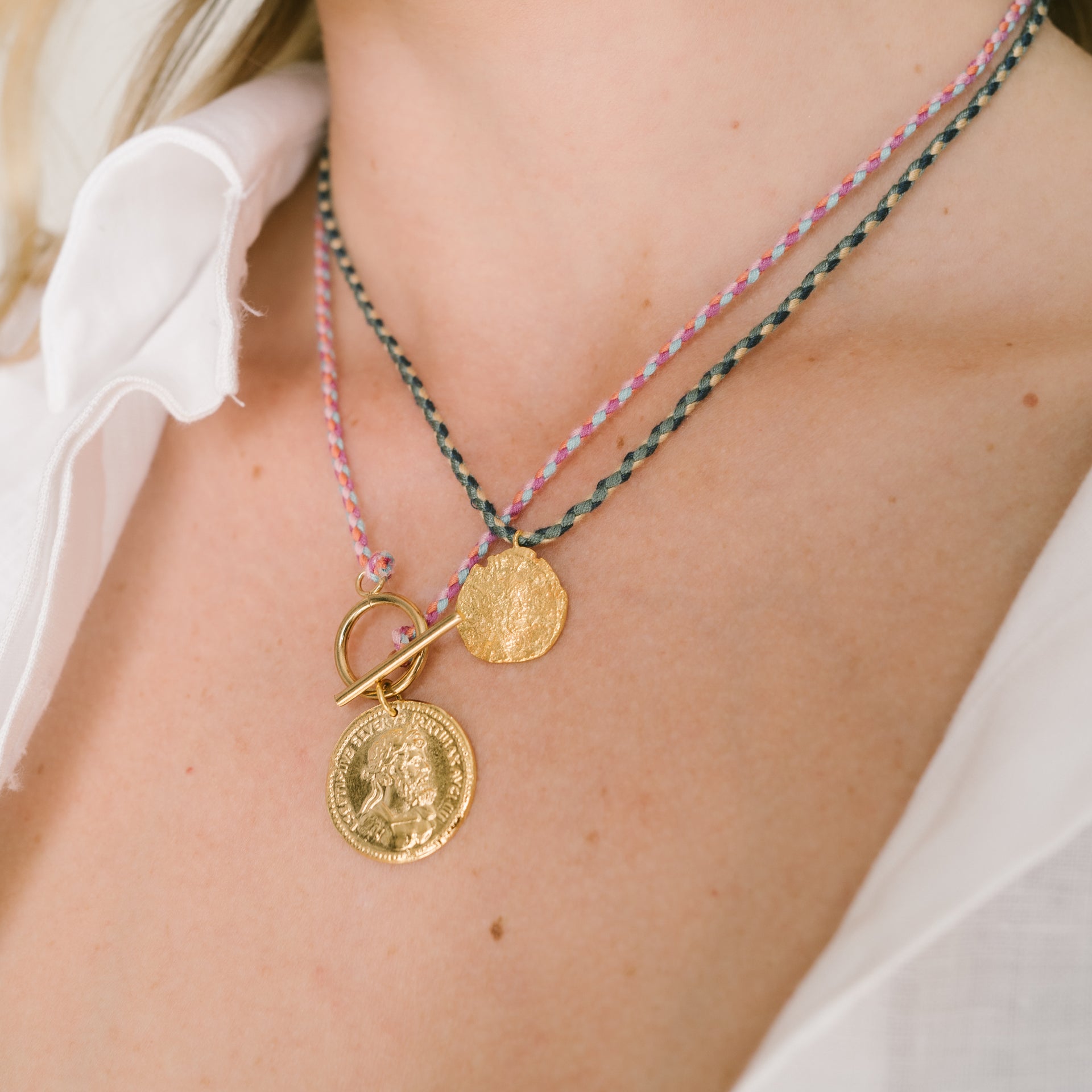 gold plated medal on a pink cotton cordon handmade by 4 crosses in paris