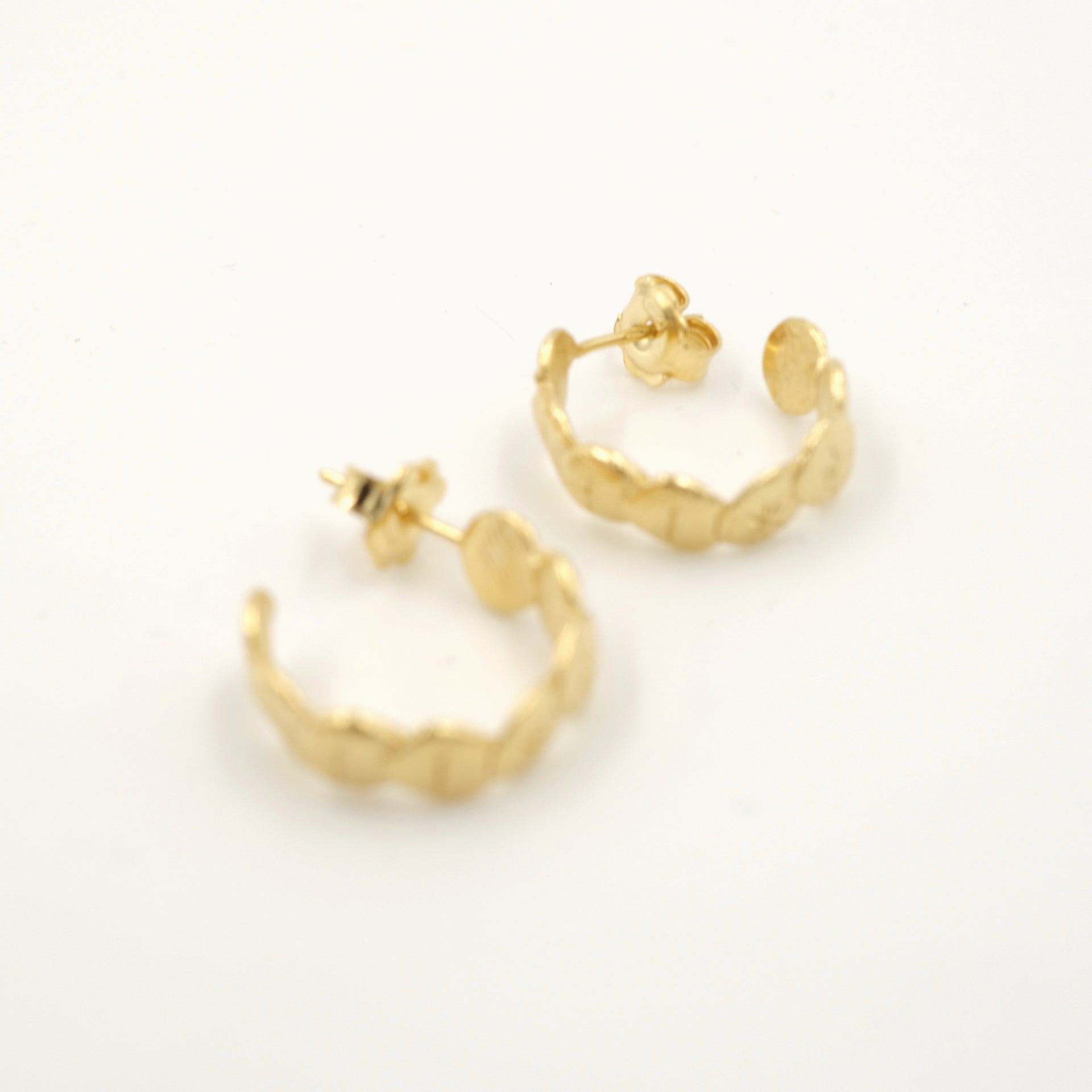 +- GOLD HOOP EARRINGS by CRISTINA JUNQUERO